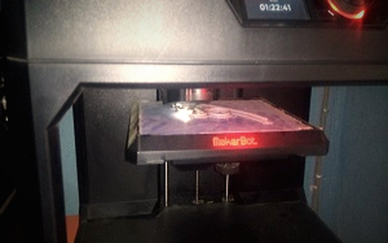A 3D printer running in a workshop